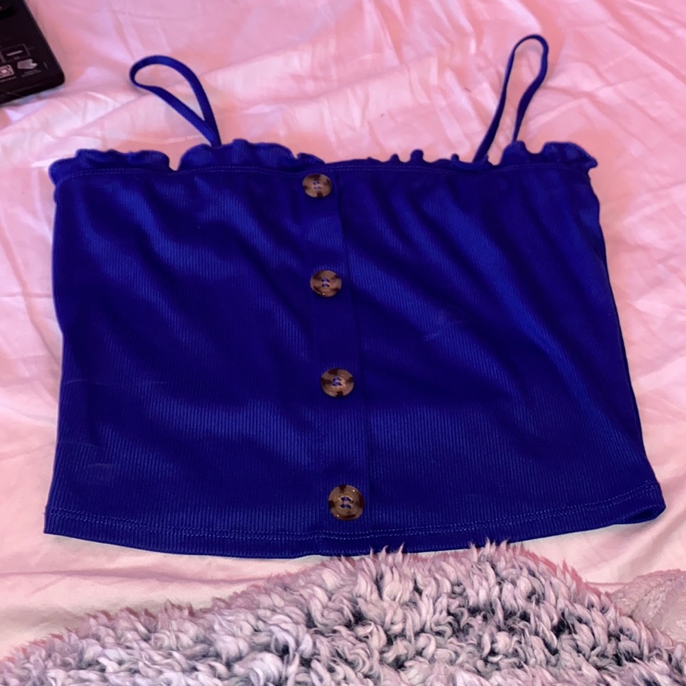 This is a cute top with buttons down the middle!